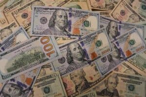 US dollar dips as risk off mood eases