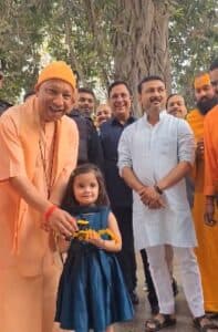 CM Yogi Adityanath Receives Toy Bulldozer from Young Admirer