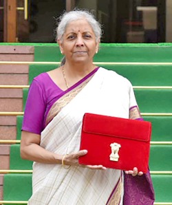 Finance Minister outside Parliament posing with a red coloured bag before presenting the union budget on July 23, 2024