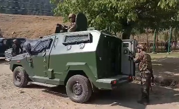 Indian army soldiers surrounding armoured vehicle in J&K