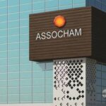 a sign of ASSOCHAM on the side of a building