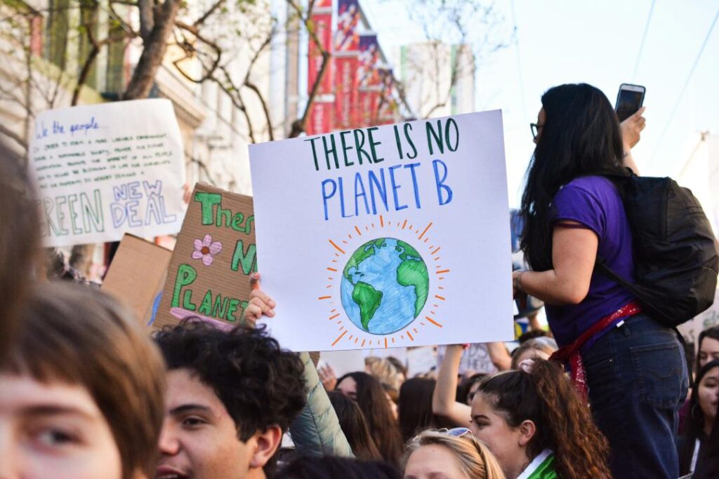 UNESCO report says change in climate disrupting education system. Students gather for a rally