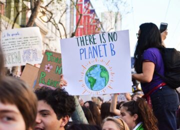 UNESCO report says change in climate disrupting education system. Students gather for a rally