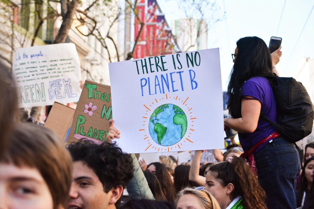 UNESCO report says change in climate disrupting education system. Students gather for a rally