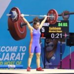 Indian Wrestler Nirabai Channu lifting weights during a competition
