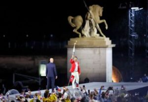 Tennis legend Rafal Nadal with the Olympic flame at the Paris Olympic 2024 opening ceremony