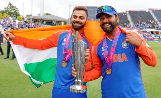 Rohit Sharma, Virat Kohli with the Indian National Flag, after winning the T20 World Cup Championship in Barbados