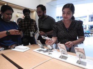 People buying mobile phones at a store in India