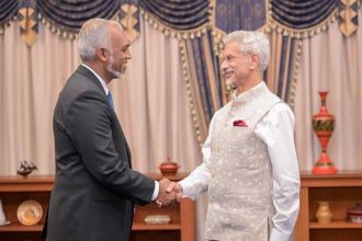 Maldives President Md Muizzu and India's External Affairs Minister Jaishankar shake hands