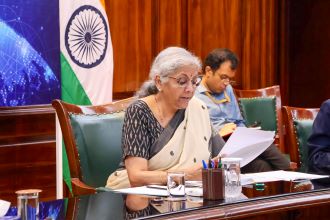 Union Finance Minister Nirmala Sitharaman reading from a paper at a meeting in Delhi.