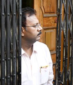 Sandip Ghosh, Ex-Principal of RG Kar Hospital in Kolkata standing at the door of his residence