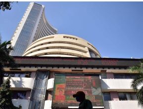 Mumbai:People walk past the Bombay Stock Exchange (BSE) building in Mumbai, on Tuesday, Feb 1. 2022.Prime Minister Narendra Modi's government on Tuesday announced a series of investments to shore up spending in infrastructure projects in its annual budget.(Photo:IANS)