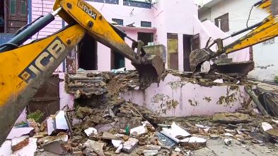 Udaipur: Bulldozer demolishes the house of the accused who stabbed another student at a school in Udaipur on Saturday, August 17, 2024.(IANS/Video Grab)