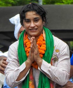 New Delhi: Wrestler Vinesh Phogat recieves a warm welcome as she arrives at IGI Airport after participating in Paris Olympics 2024 in New Delhi on Saturday August 17, 2024. (Photo: IANS/Anupam Gautam)